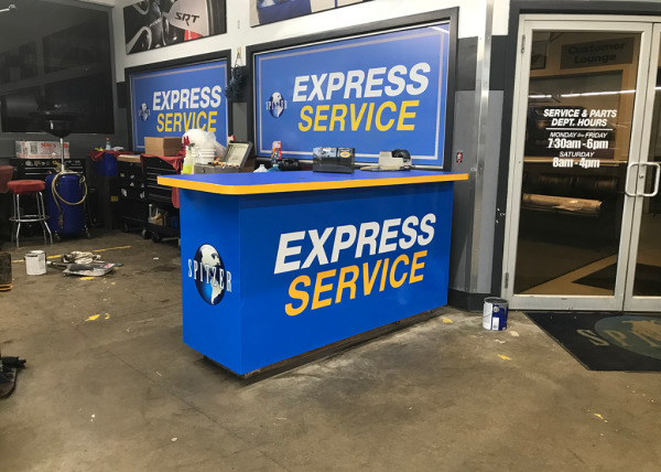 "Express Service" counter graphics at a Spitzer dealership
