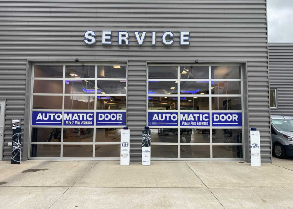 Photo of a dealerships garage service department with signage made by Oliver Signs & Graphics.