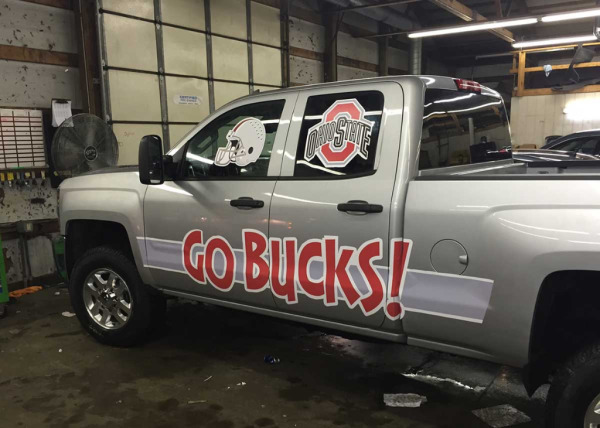 Silver truck with Ohio State football graphics made by Oliver Signs & Graphics.