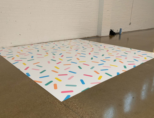 Floor graphic with sprinkles on a white background