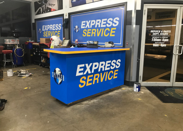 Spitzer auto dealership service desk counter graphics