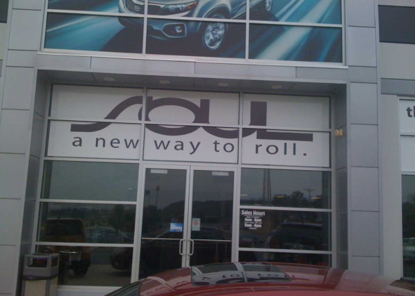 Custom window advertising decals for Kia dealership