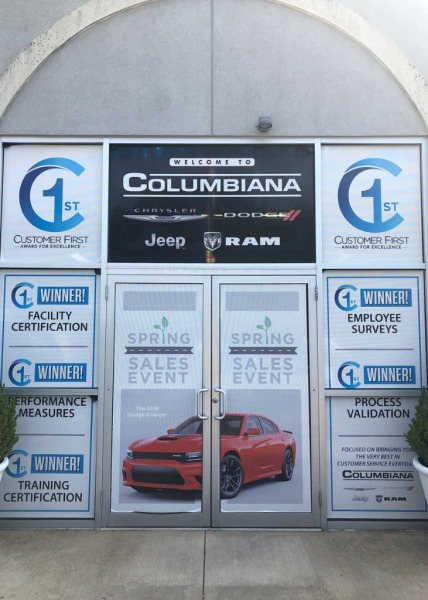 Custom window decals & glass door decals advertising spring sales event at Columbiana Chrysler Dodge Jeep Ram dealership