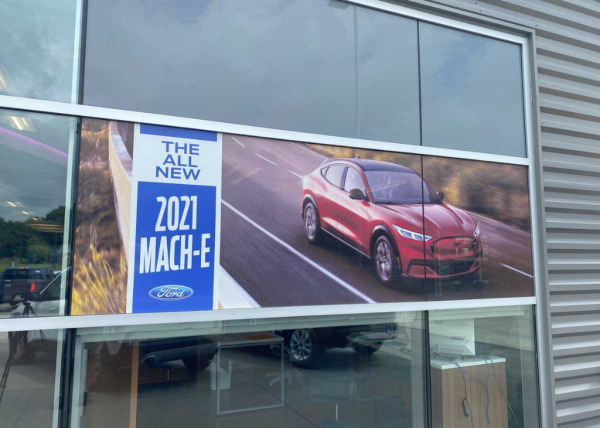Custom window decals advertising the 2021 Ford Mach-e