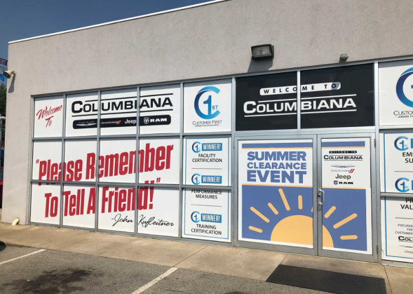 Custom window decals & glass door decals advertising summer clearance event at Columbiana Chrysler Dodge Jeep Ram dealership