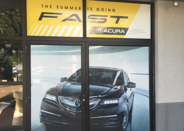 Acura dealership door view-through decals for summer sales event