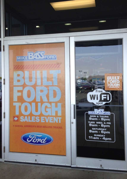 Door view-through decals at Mike Bass Ford dealership in Sheffield, OH