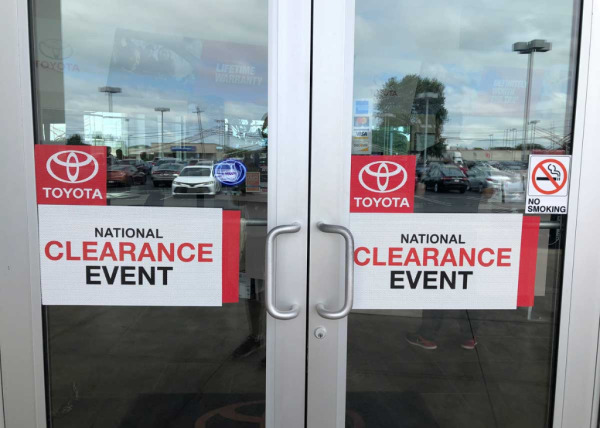 "National Clearance Event" door ad band decals at Toyota dealership