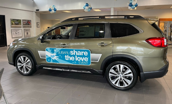 "Share the Love" event magnetic vehicle sign at Subaru dealership