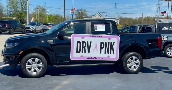 "Drive Pink" magnetic vehicle sign on truck at AutoNation